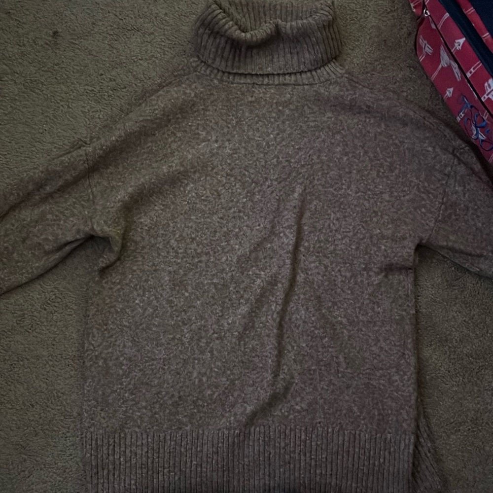 A turtleneck sweater never worn